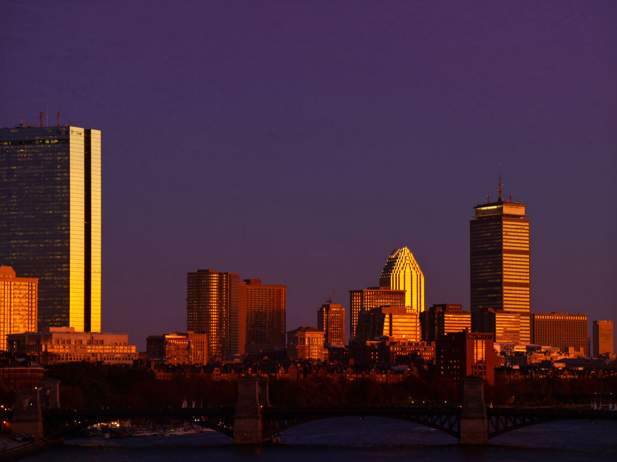 Golden-hour skyline view of Boston and the Charles River, representing Greater Boston senior living communities